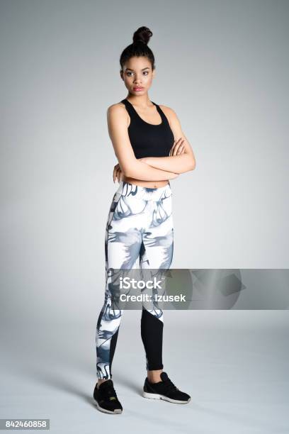 Confident Afro American Young Woman In Sports Wear Studio Shot Stock Photo - Download Image Now