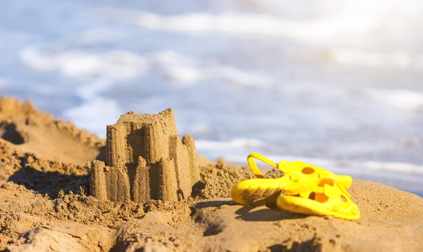 istock Sand castle and toys at the beach isolated over white background 842461954