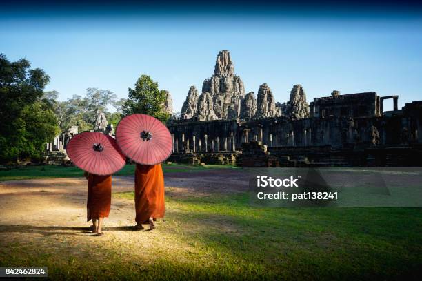 Ancient Stone Faces Of Bayon Temple Stock Photo - Download Image Now - Cambodia, Siem Reap Province, Monk - Religious Occupation