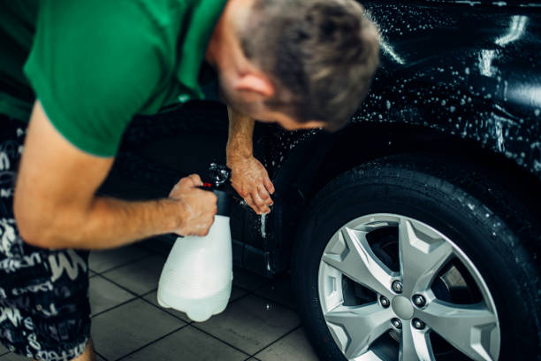 istock Worker disperses soapy water, paint protection 842463424