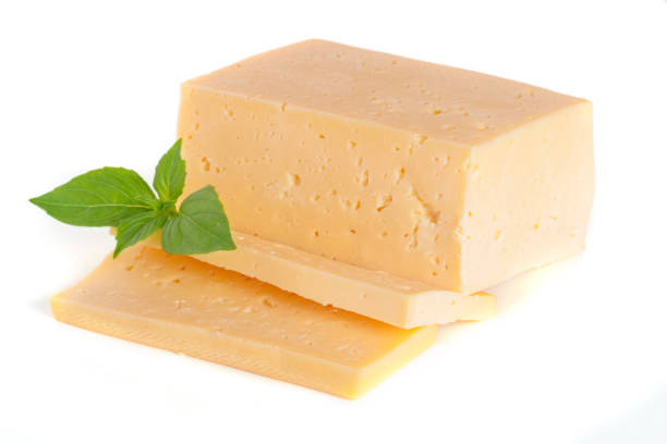 istock cheese with basil leaves isolated on white background 842463622