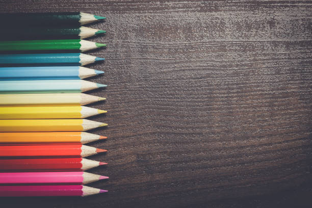 istock multicolored pencils on the brown wooden table background 842463868