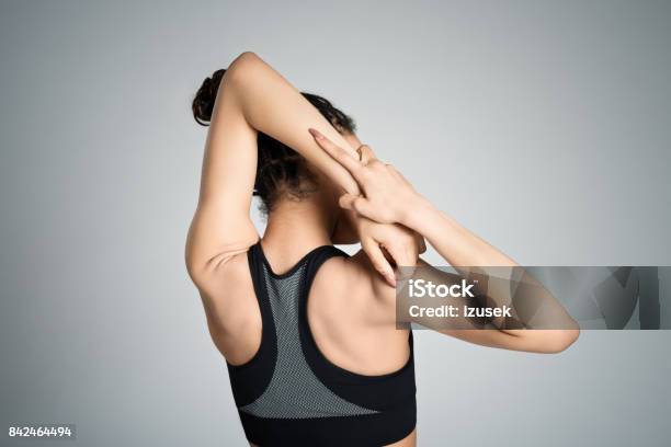 Back View Of Young Woman Stretching Her Arms Stock Photo - Download Image Now - 16-17 Years, Adult, African-American Ethnicity