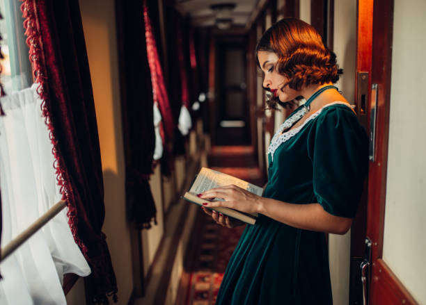 istock Young woman travels, vintage train compartment 842465004