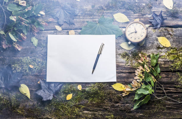 istock old wooden table with autumn leaves top view 842469912
