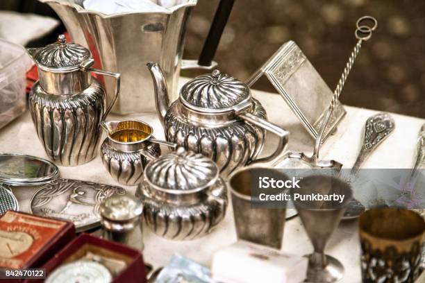 Antique Silver Teapots Creamer And Other Utensils At A Flea Market Stock Photo - Download Image Now