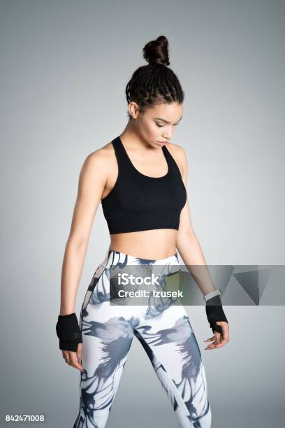 Powerful Afro American Young Woman In Sports Wear Studio Shot Stock Photo - Download Image Now