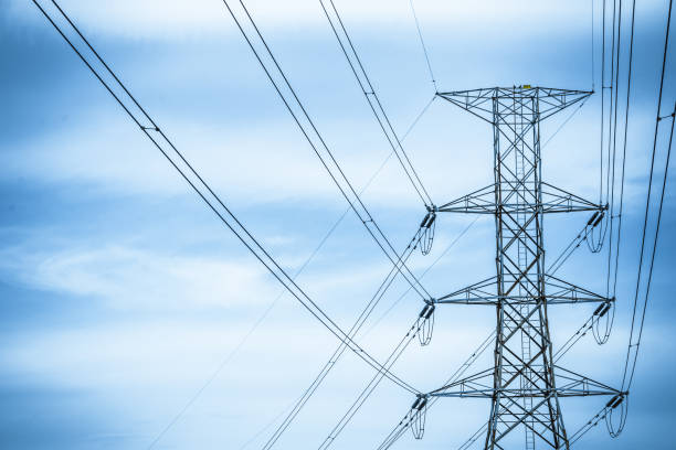 istock Electricity station. Close up high voltage power lines at sunset. 842471308