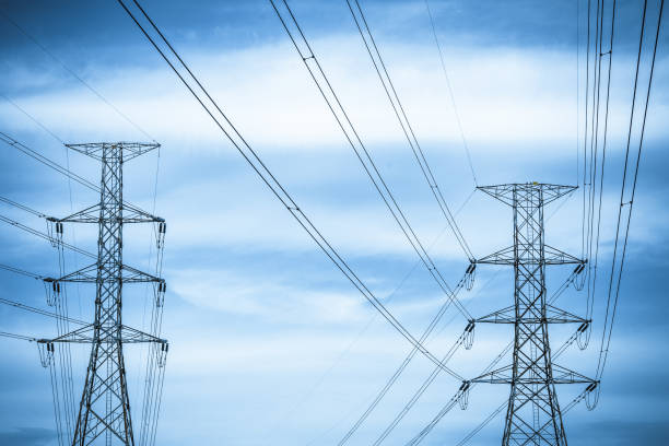 istock Electricity station. Close up high voltage power lines at sunset. 842472528