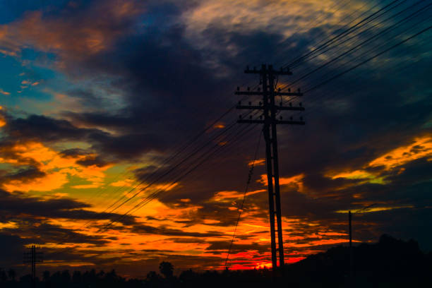 istock Electricity station. Close up high voltage power lines at sunset. 842472712