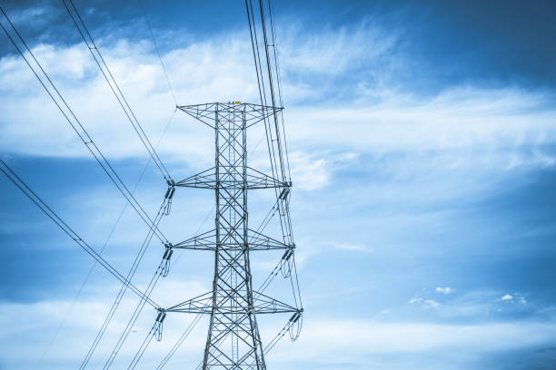 istock Electricity station. Close up high voltage power lines at sunset. 842472950