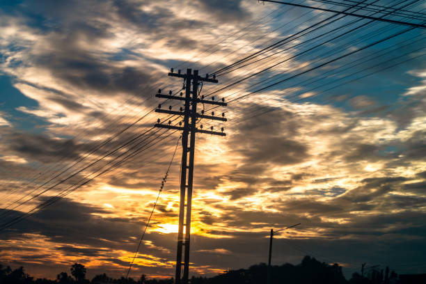 istock Electricity station. Close up high voltage power lines at sunset. 842473038