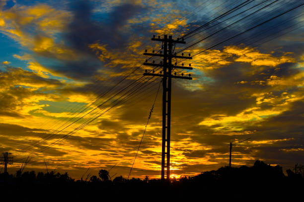 istock Electricity station. Close up high voltage power lines at sunset. 842473238