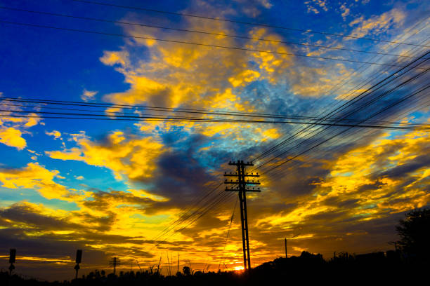 istock Electricity station. Close up high voltage power lines at sunset. 842473334
