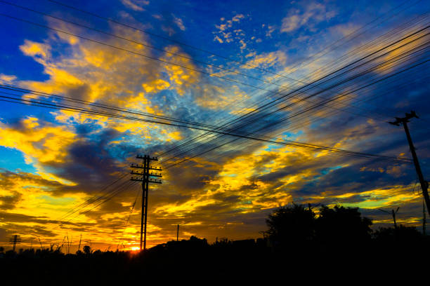 istock Electricity station. Close up high voltage power lines at sunset. 842473964
