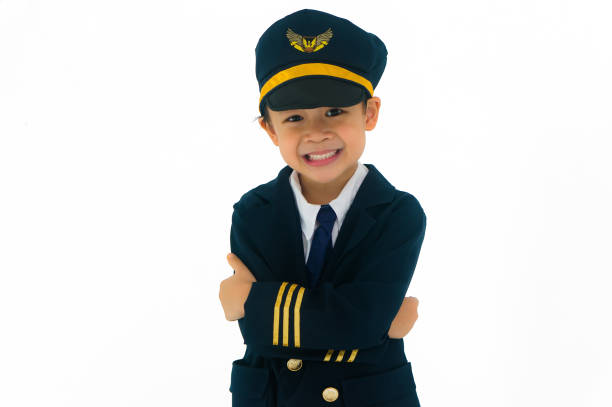 Asian boy wearing pilot uniform, smiling happily. Isolated on white background. stock photo