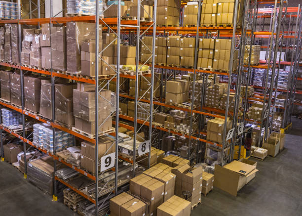 Interior of warehouse with racks full of boxes stock photo