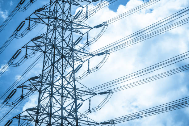 istock Electricity station. Close up high voltage power lines at sunset. 842474502