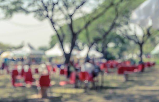 istock Blurred image of a fair in green park 842474630