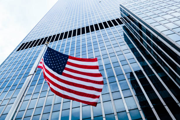 istock American flag in front of Manhattan skyscraper 842476380