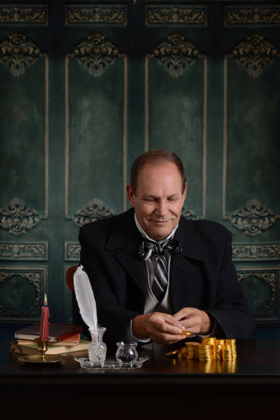 istock victorian banker counting his money 842476738