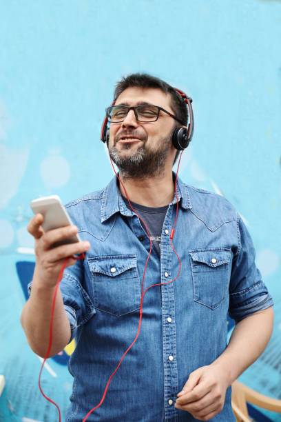 istock Man listen music in city 842478730