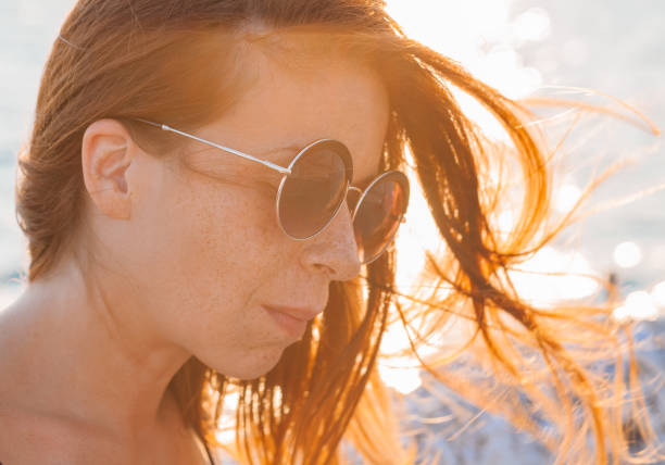 istock Young woman by the sea 842480004