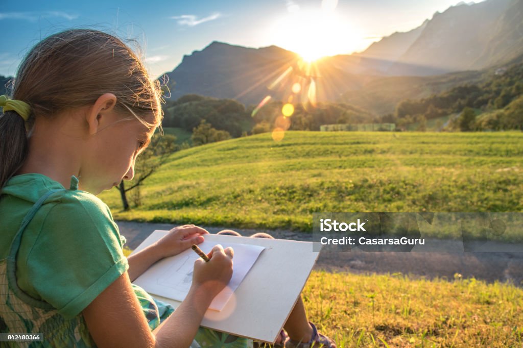 https://media.istockphoto.com/id/842480366/photo/8-years-old-girl-sitting-in-the-meadow-and-drawing-the-mountain-view.jpg?s=1024x1024&w=is&k=20&c=q0ofjVN5BoS5cDYkA-rfoxsMHUlmftCIDlJSSUchdmU=