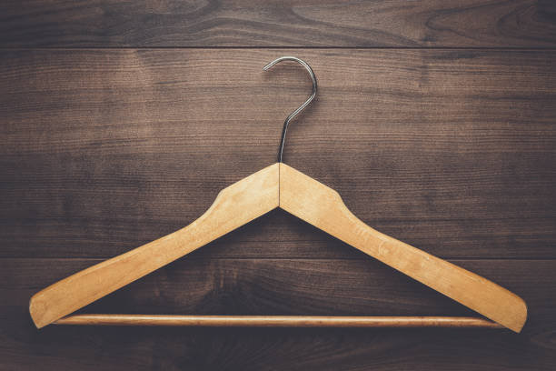 istock clothing hanger on brown table 842481128