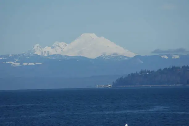 I believe this is Mount Baker taken on a Washington State ferry headed to Kingston,WA