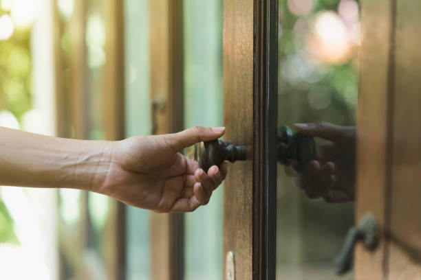 istock hand hold handle of door, close up 842482438