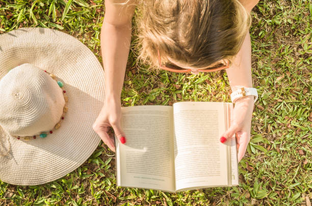istock Pretty woman reading book 842483866