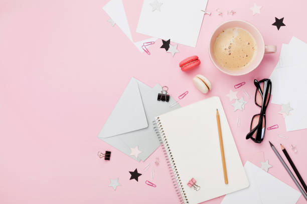 istock Coffee, macaron, office supply and clean notebook on pink pastel table top view for blogging. Flat lay. Morning breakfast. Fashion woman working desk. 842488622