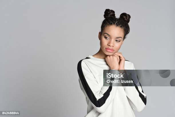 Pensive Afro American Cute Teenager Woman Stock Photo - Download Image Now - Hair Bun, Braided Hair, African Ethnicity