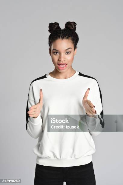 Happy Afro American Teenager Woman Explaining Stock Photo - Download Image Now - Talking, Explaining, Teenager