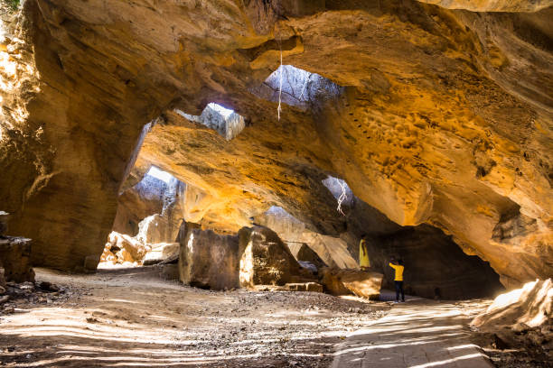 Naida caves, Diu The Naida cave at Diu, India,  have been created by the Portuguese. Here they obtained the stone, to build the Fort. diu island stock pictures, royalty-free photos & images