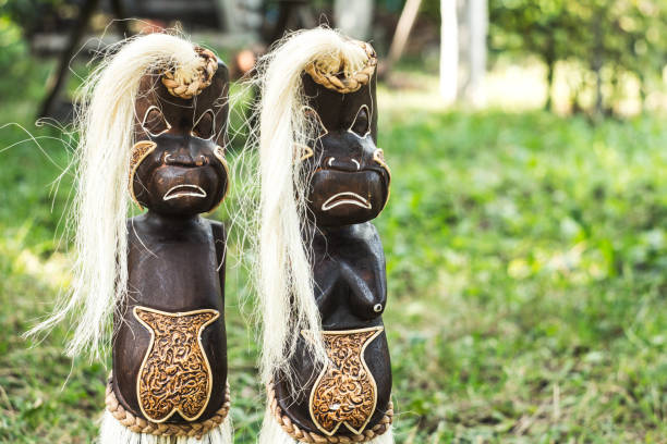 a wooden figures of people from tribes
