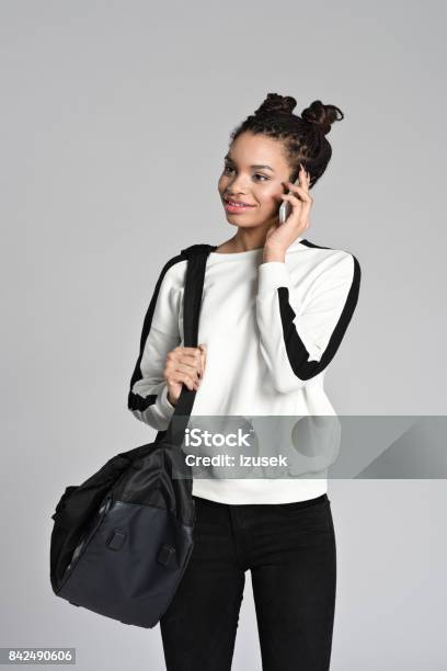 Happy Afro American Teen Girl Using Smart Phone Stock Photo - Download Image Now - 16-17 Years, 18-19 Years, Adolescence