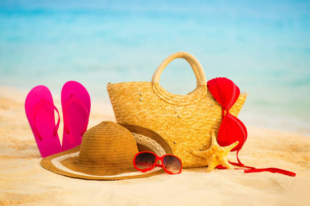 istock Summer beach with accessories. Blur azure sea on background 842494096