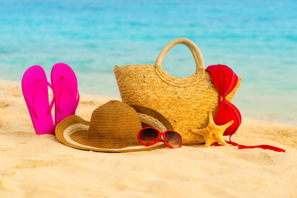 istock Summer beach with accessories. Blur azure sea on background 842496188