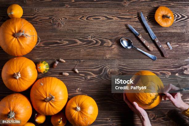 Ripe Yellow Pumpkins Over Wooden Background Stock Photo - Download Image Now - Pumpkin, Carving Food, Carving - Craft Activity