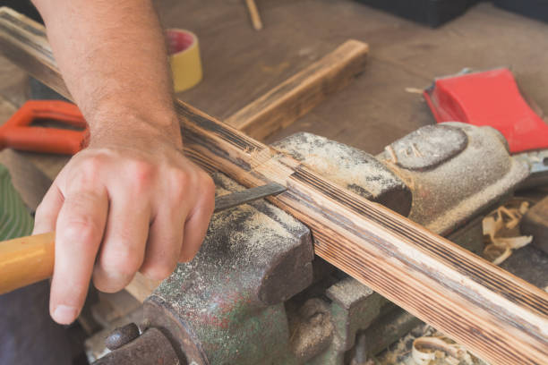 istock Male carpenter working on raw wood / boards / plank. 842589806