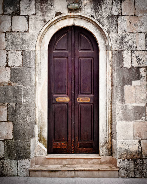 Small old wooden church door stock photo