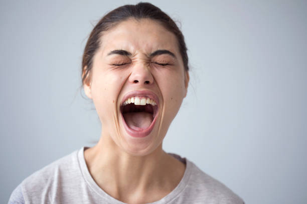 istock Portrait of shouting young woman 842596486