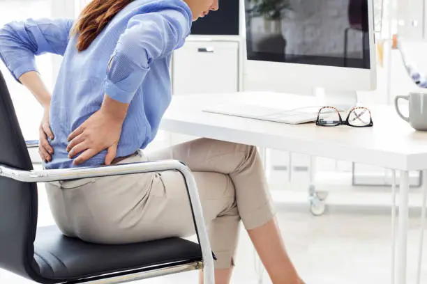 Photo of Businesswoman with pain in back