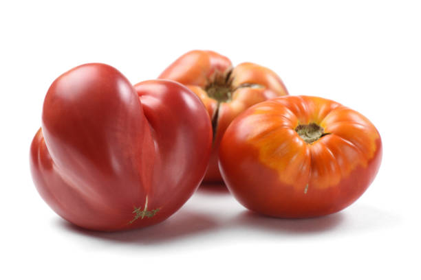 istock Heirloom fresh juicy tomatoes irregular in shape isolated 842600014