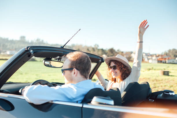 istock Couple riding a convertible at sunny day 842602542