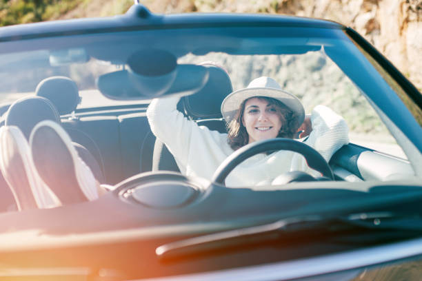 istock Beautiful girl resting in a convertible 842602780