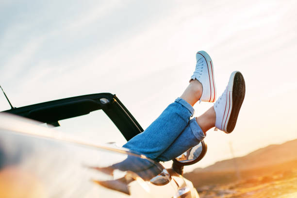 istock Young woman resting in convertible 842603344