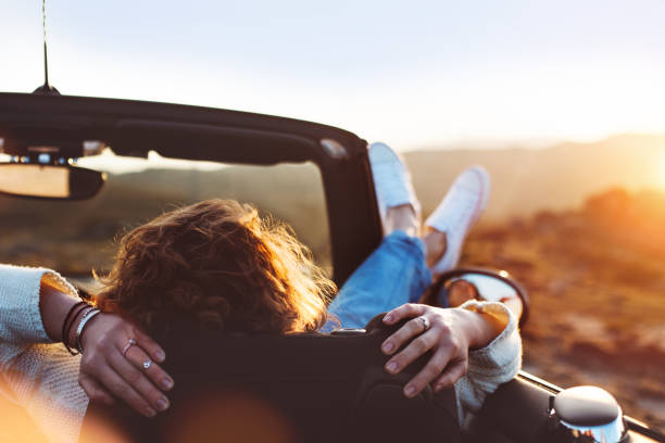 istock Young woman resting in convertible 842603366